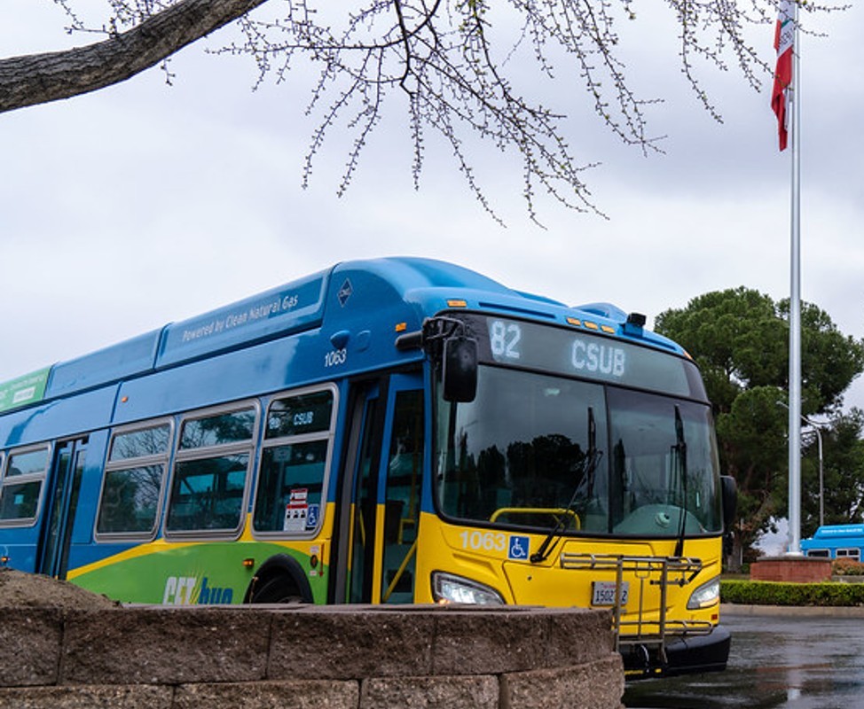Bus parked in front of CSUB's flagpole