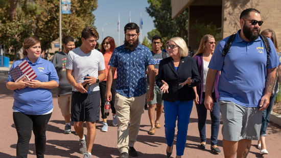 CSUB students and President Zelezny chatting while walking around campus