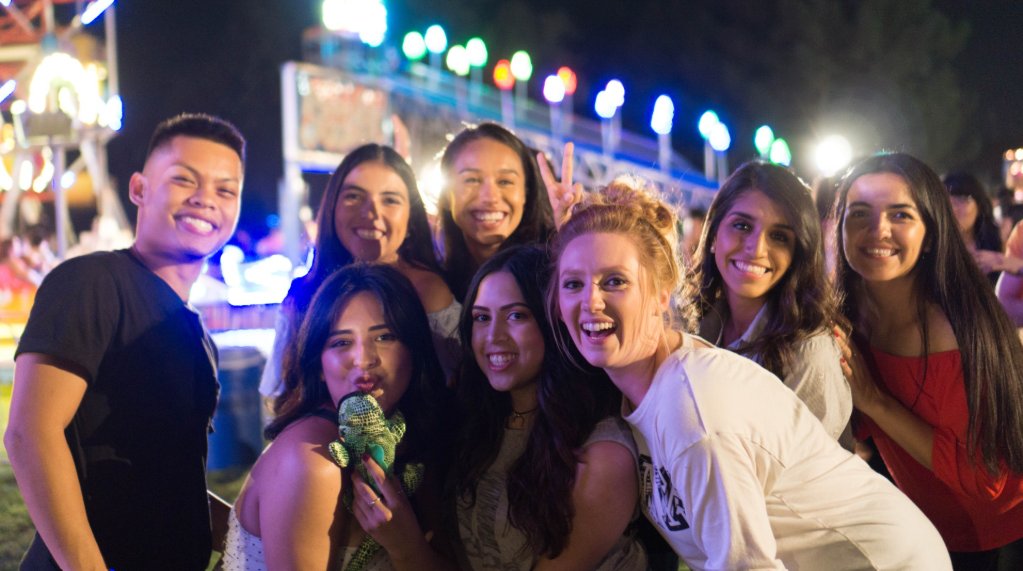 students having run at an athletic event posing for a picture