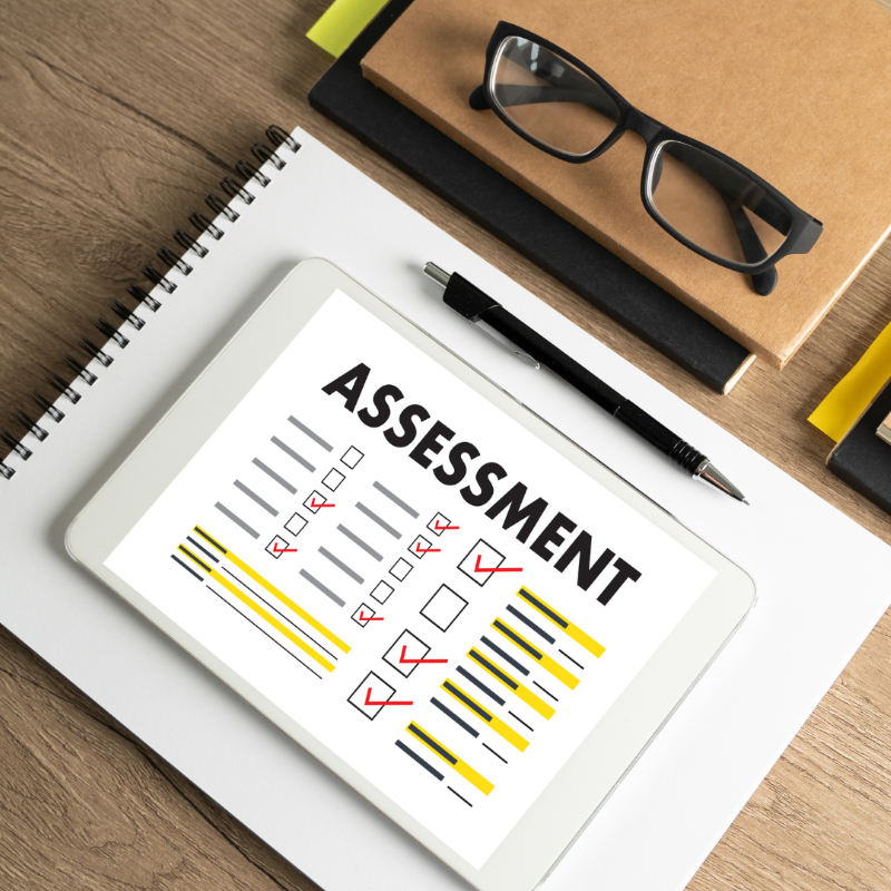 a computer displays a paper with checkmarks for assessing learning