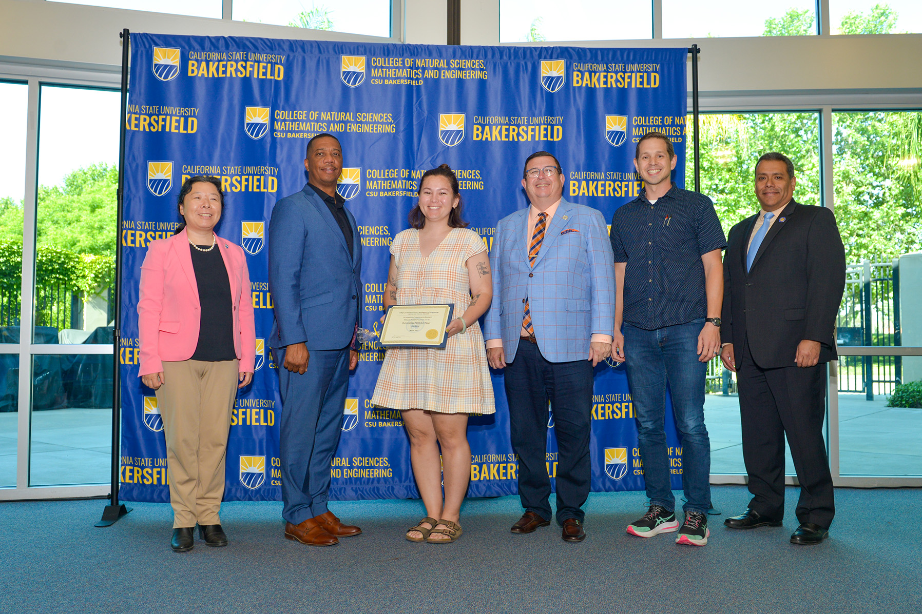 Maggie receiving her award
