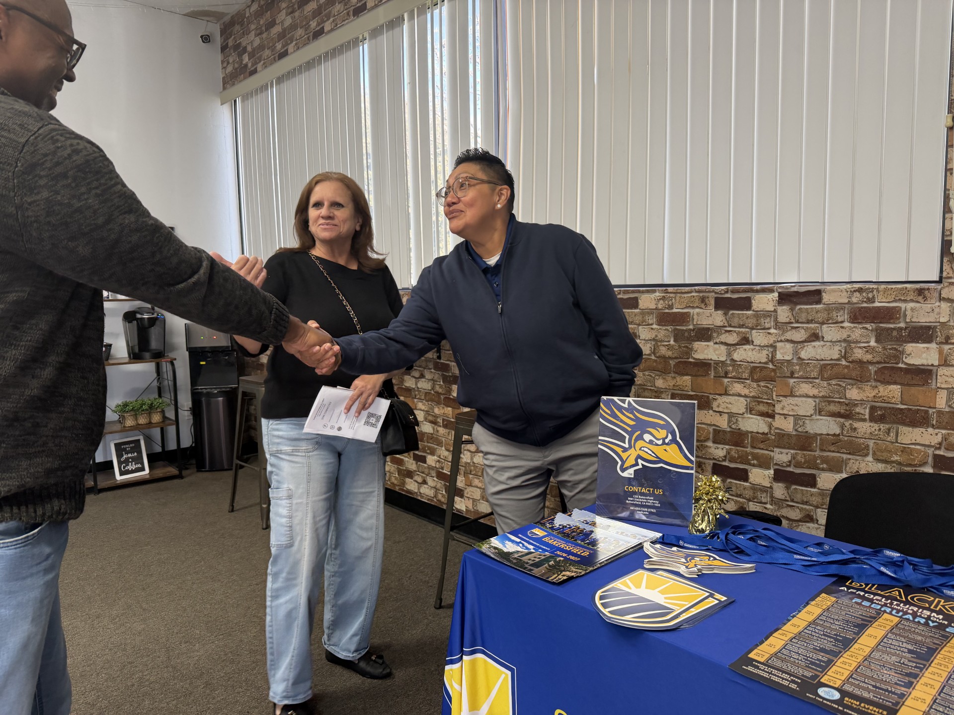 Marlene Ortega shaking hands with another person
