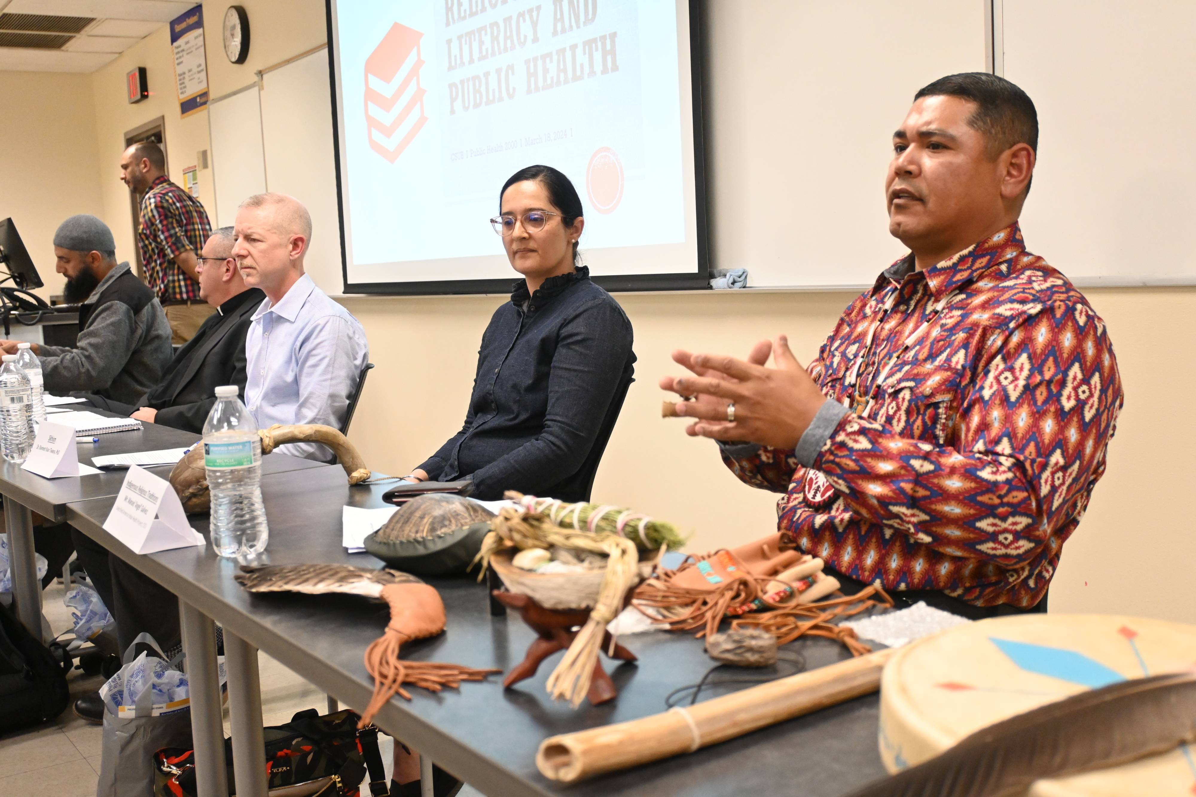 Religious leaders speak in a classroom