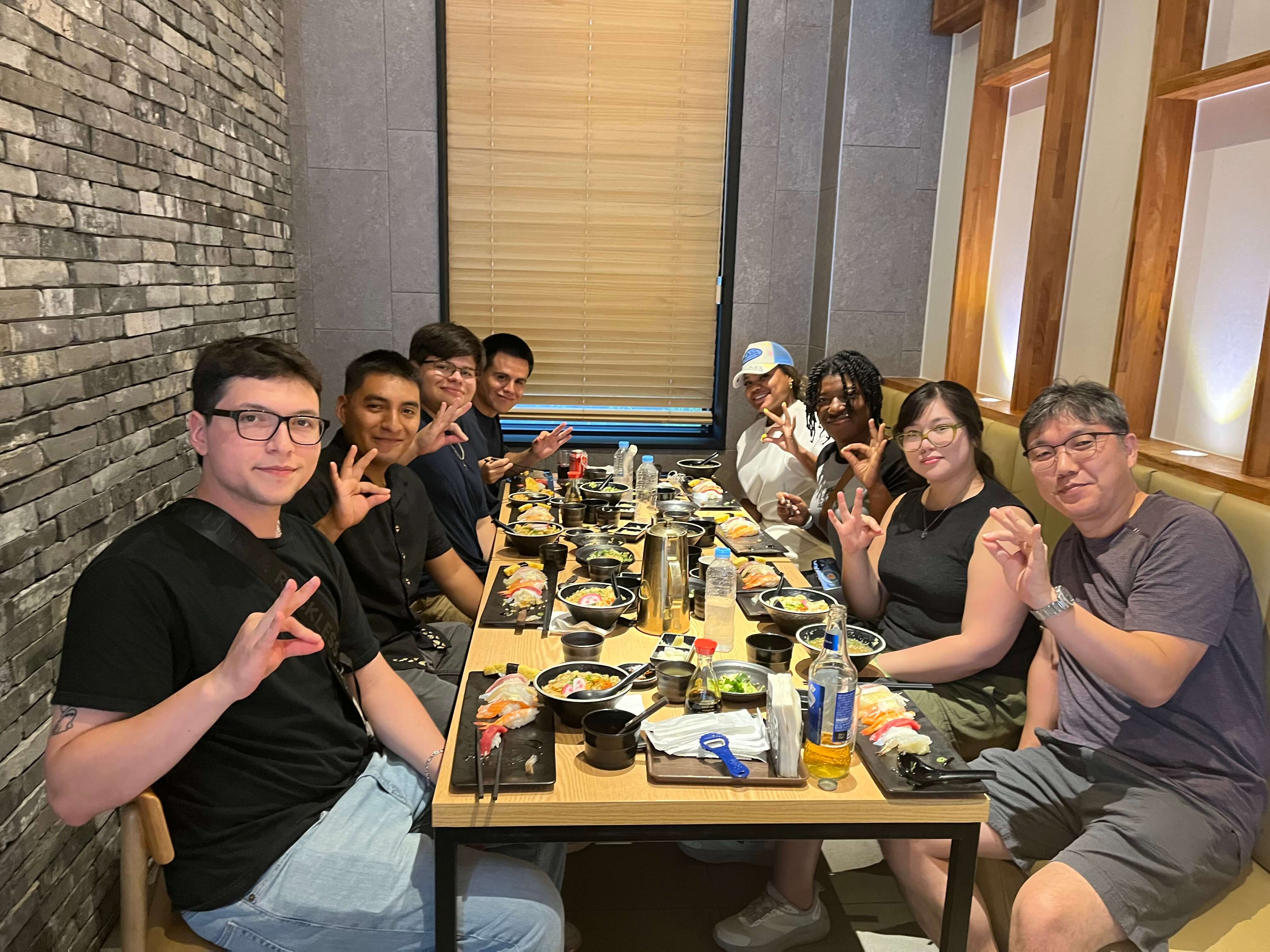 The FLP Korea group showing 'Runners up while eating at a Korean restaurant.
